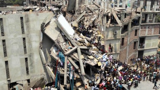 People and rescuers gather after an eight-story building housing several garment factories collapsed in Savar, near Dhaka, Bangladesh, April 24, 2013.